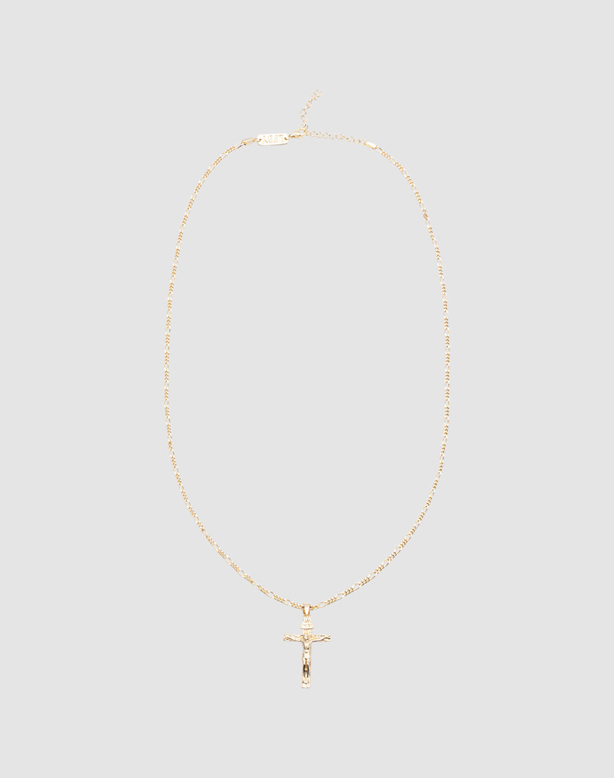 The LIVE FAST DIE YOUNG Cross Pendant is a gold necklace with a fine chain and detailed crucifix, crafted in 925 vergoldet, shown on a plain light gray background.