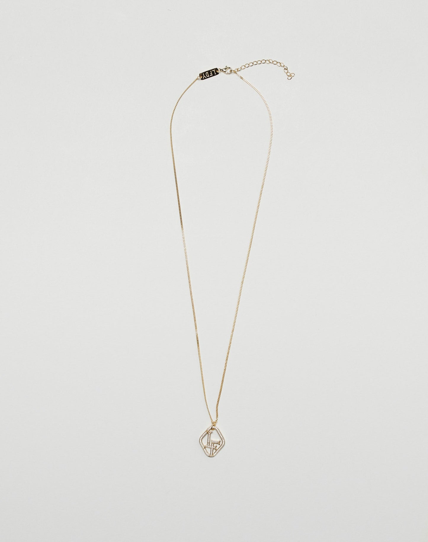 The LF Chain by LIVE FAST DIE YOUNG is a sleek, gold-plated sterling silver necklace with a geometric wireframe pendant set with zirconia stones and an adjustable clasp, shown on a plain white background.
