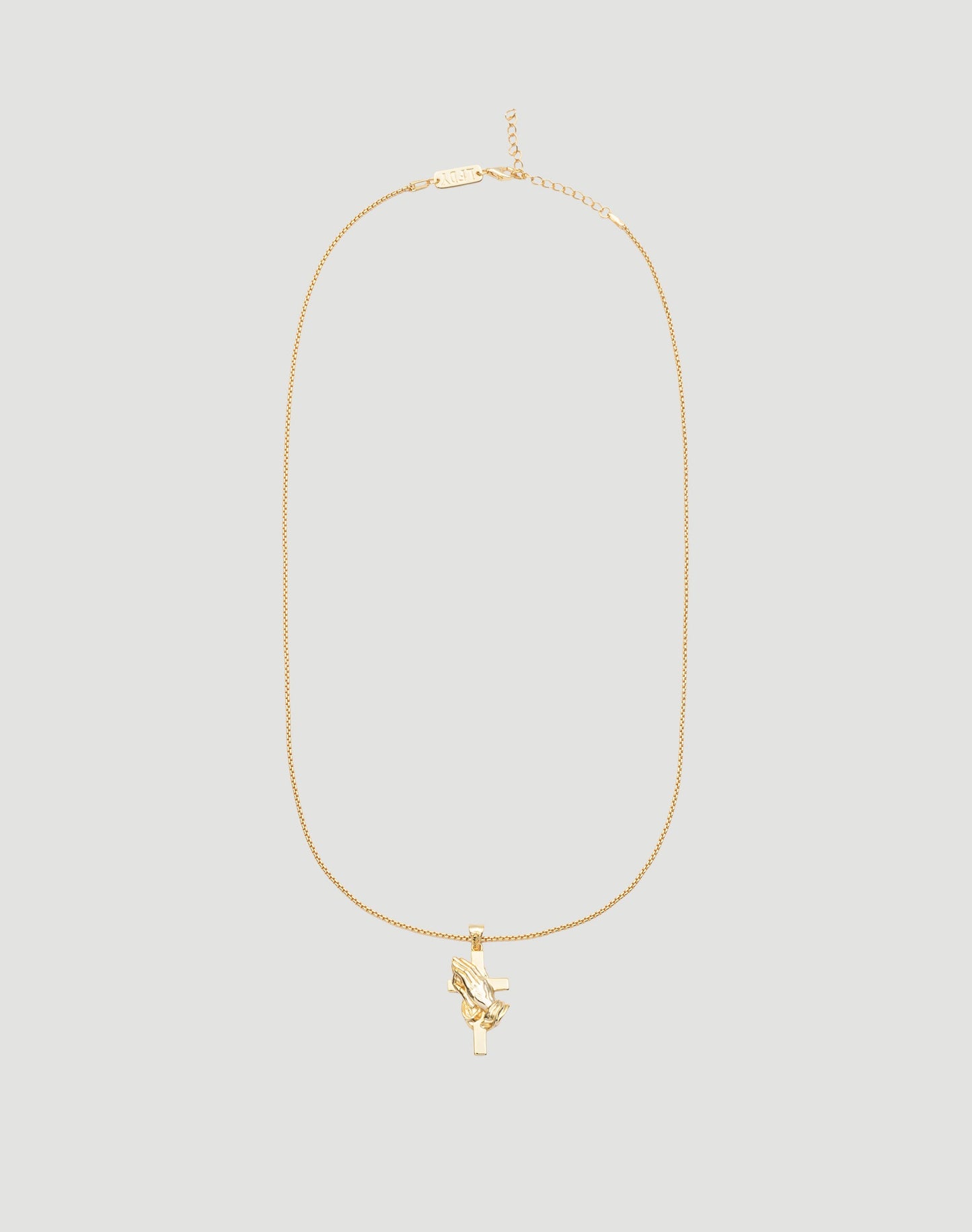 The LFDY Praying Chain by LIVE FAST DIE YOUNG features a gold box chain and a pendant with praying hands on a cross, shown against a light gray background.