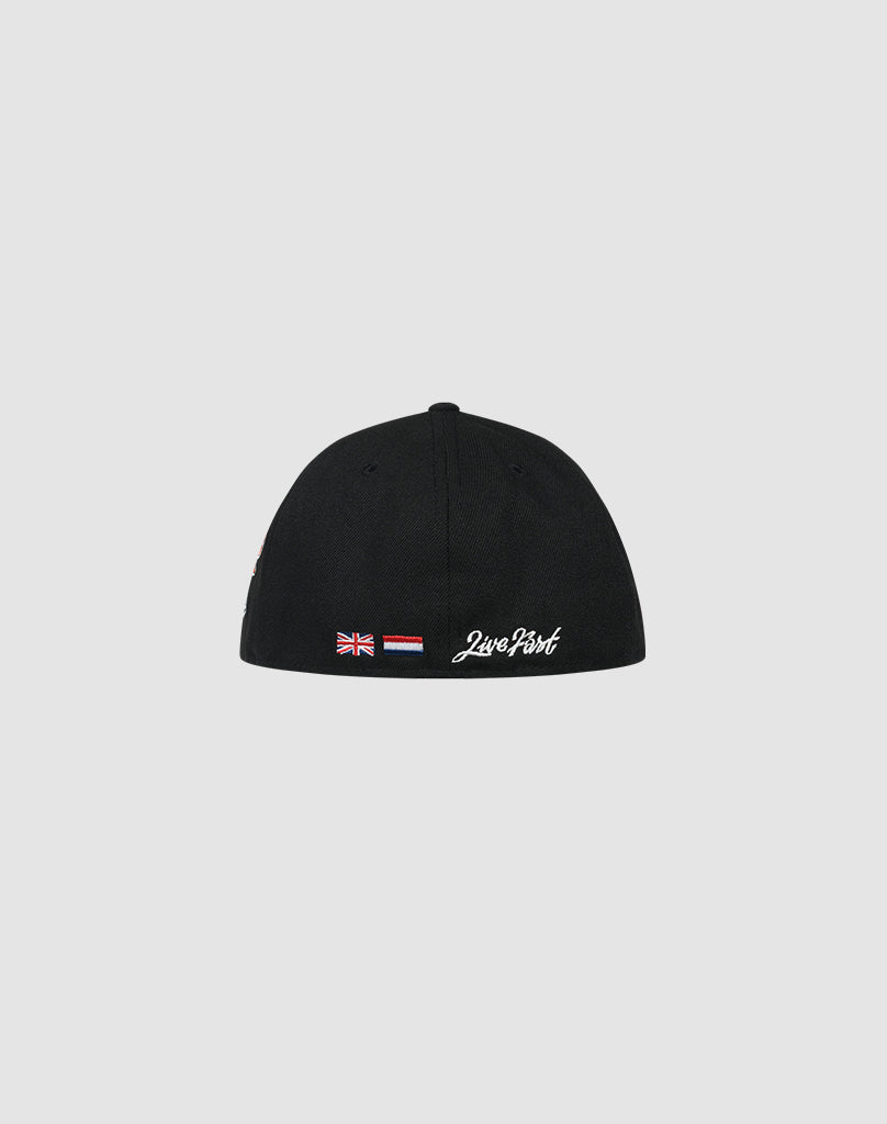 A black LFDY x New Era 59FIFTY Low Profile fitted cap by LIVE FAST DIE YOUNG is shown from the back with a small Union Jack, Dutch flag, and white cursive Just Don. text on a light gray background.
