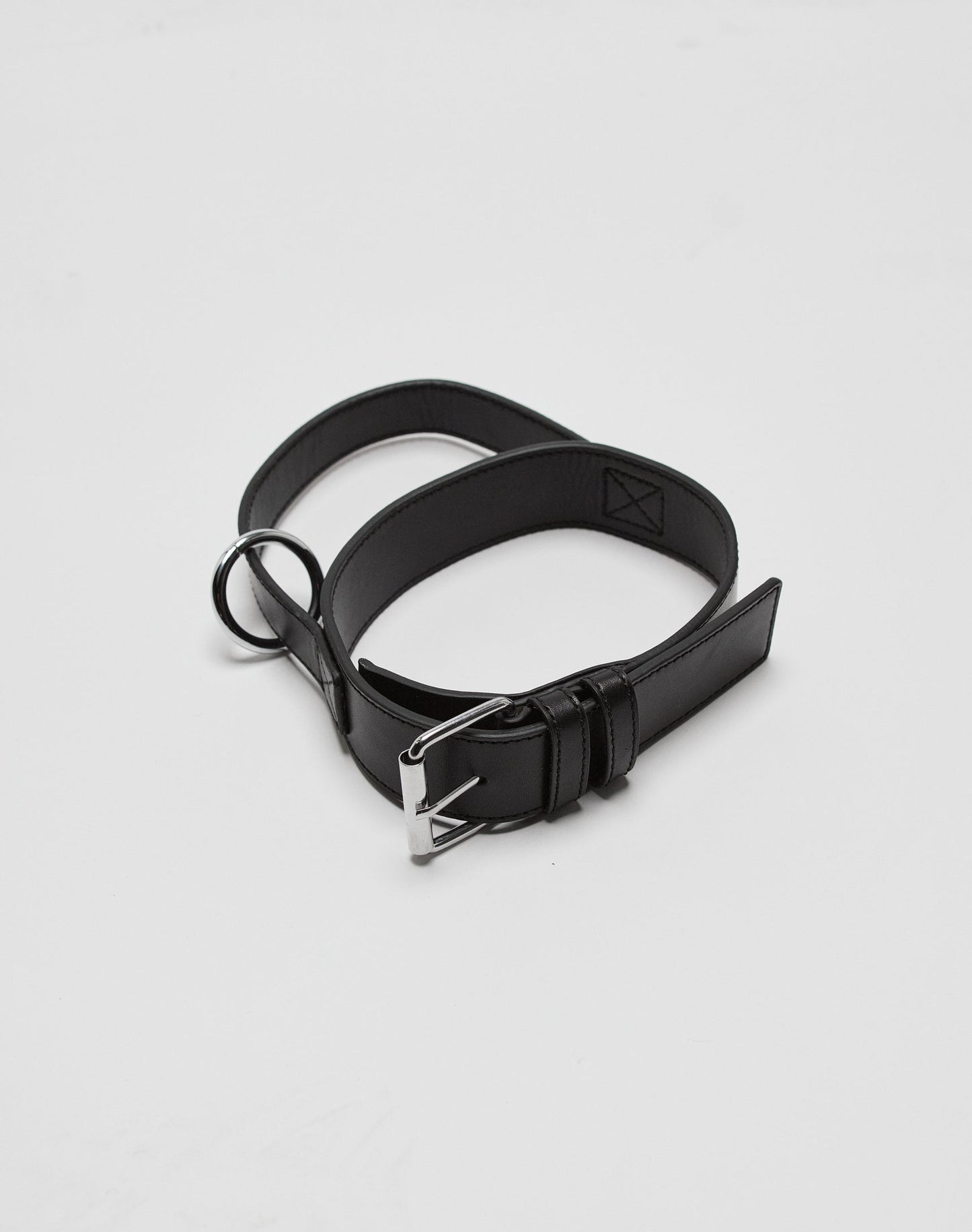 The LFDY Dog Collar by LIVE FAST DIE YOUNG is crafted from 100% Leder in black, featuring a silver Edelstahl Schnalle and a metal ring, shown coiled loosely on a plain white background.