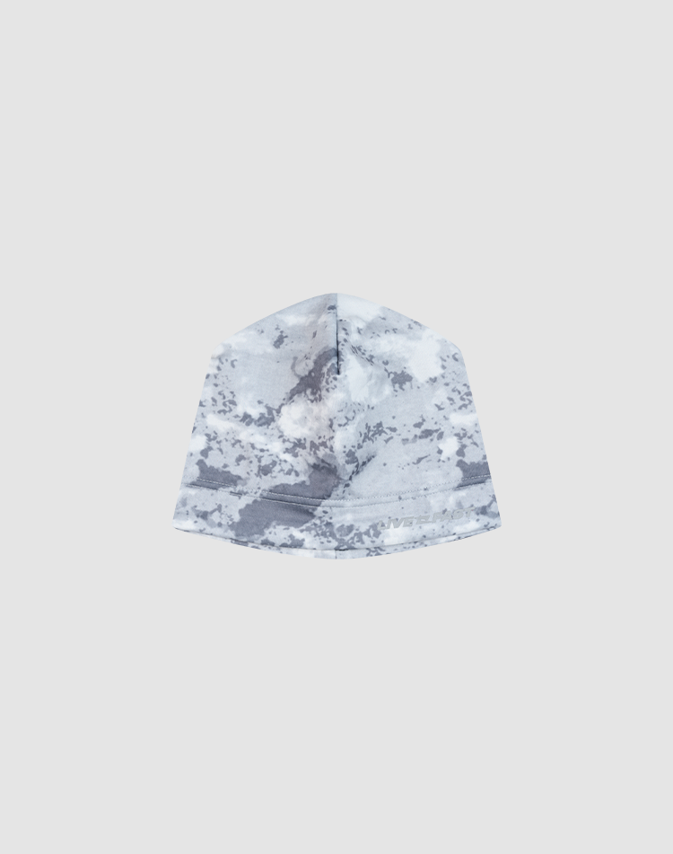 The Live Fast Performance Beanie by LIVE FAST DIE YOUNG features a gray and white camouflage pattern, fleece lining, and a subtle logo print, displayed against a plain light gray background.