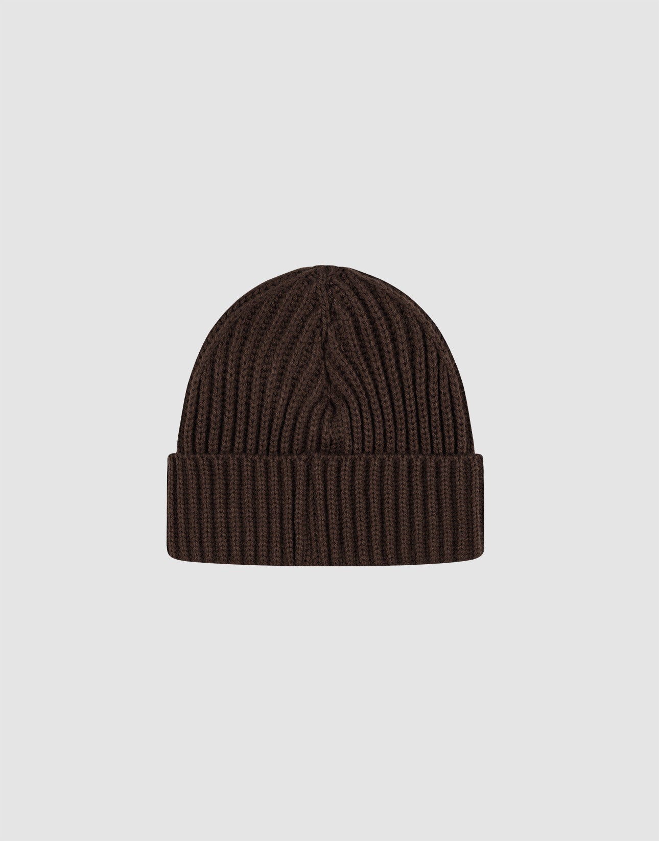 The Rib Knit Beanie by LIVE FAST DIE YOUNG features a dark brown hue, folded brim, and soft Polyacryl fabric in a versatile one-size fit, shown on a plain light gray background.