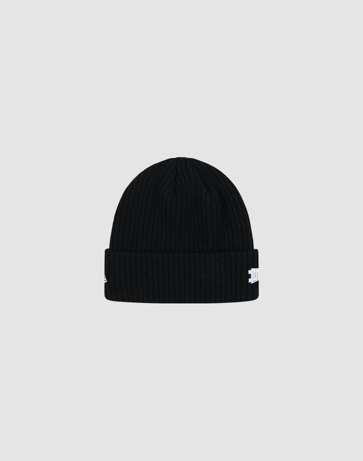 The LFDY x New Era Beanie by LIVE FAST DIE YOUNG is a black, ribbed knit beanie with a folded brim and a small white DY Logo tag on the side, shown against a plain light gray background.
