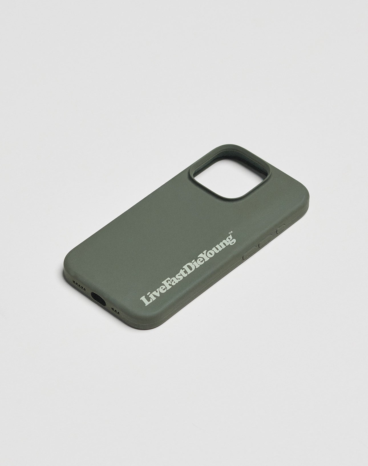 The Basic Phone Case by LIVE FAST DIE YOUNG in dark green features a bold white LiveFastDieYoung logo print on the back, made from protective TPU and shown on a plain white surface.