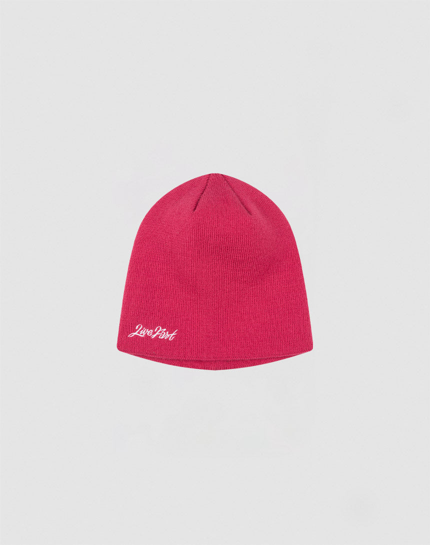 The Script Beanie by LIVE FAST DIE YOUNG is a plain red polyacryl knit hat featuring a white Love Pink logo on the lower edge, showcased against a light gray backdrop.