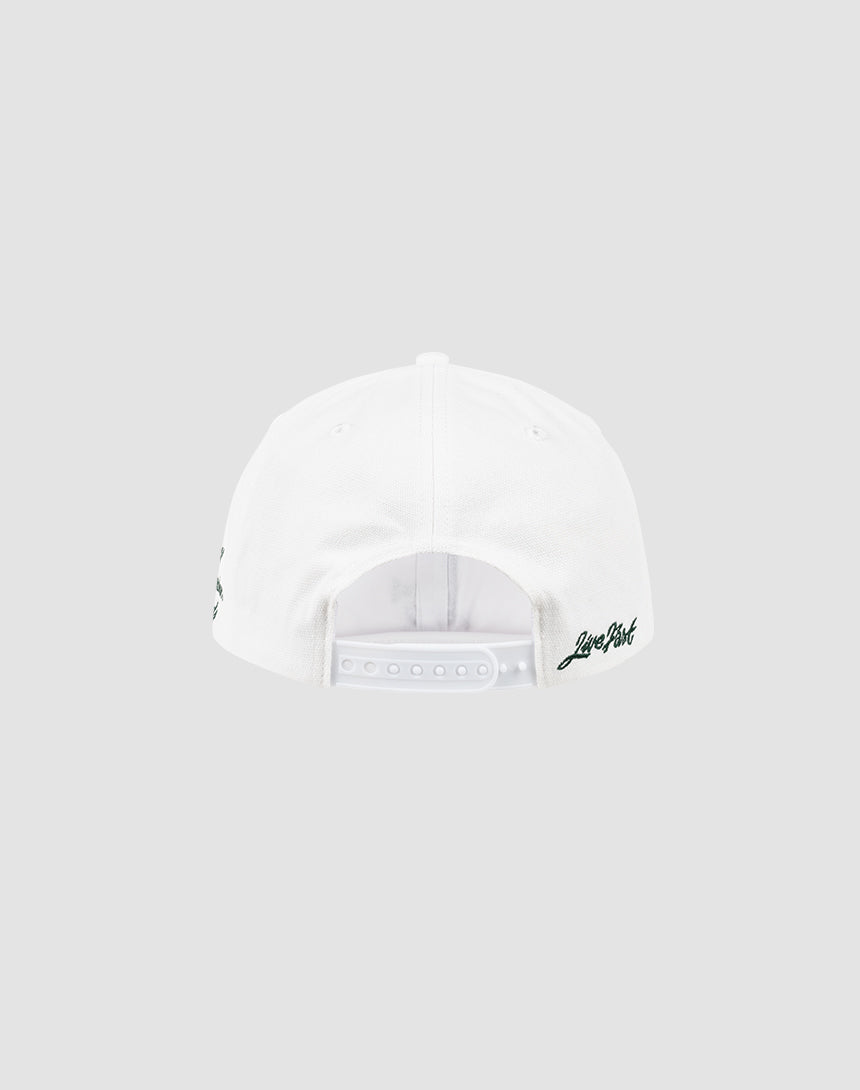 A white LF Snapback by LIVE FAST DIE YOUNG, shown from the back with an adjustable snap closure and small black Logo-Stick text embroidered on the lower right side. Set against a plain light gray background.