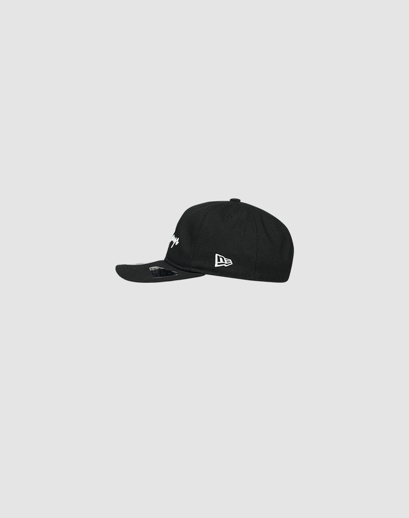 The LFDY X NEW ERA Monaco Boys cap by LIVE FAST DIE YOUNG is a black 9Fifty A-Frame with a curved brim, shown from the side on a light gray background. It features classic white embroidered logos on the front and side.