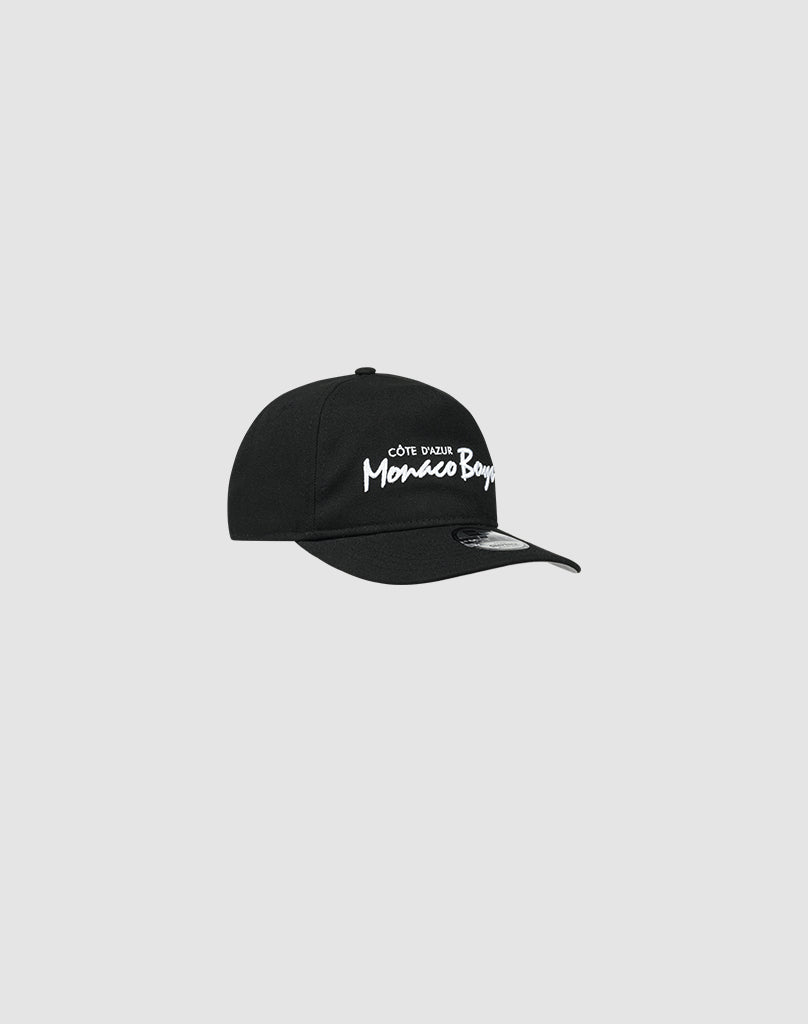 The LFDY X NEW ERA Monaco Boys black Retro Crown baseball cap by LIVE FAST DIE YOUNG features white “Côte d’Azur Monaco Boys” embroidery on the front, shown on a plain light gray background.