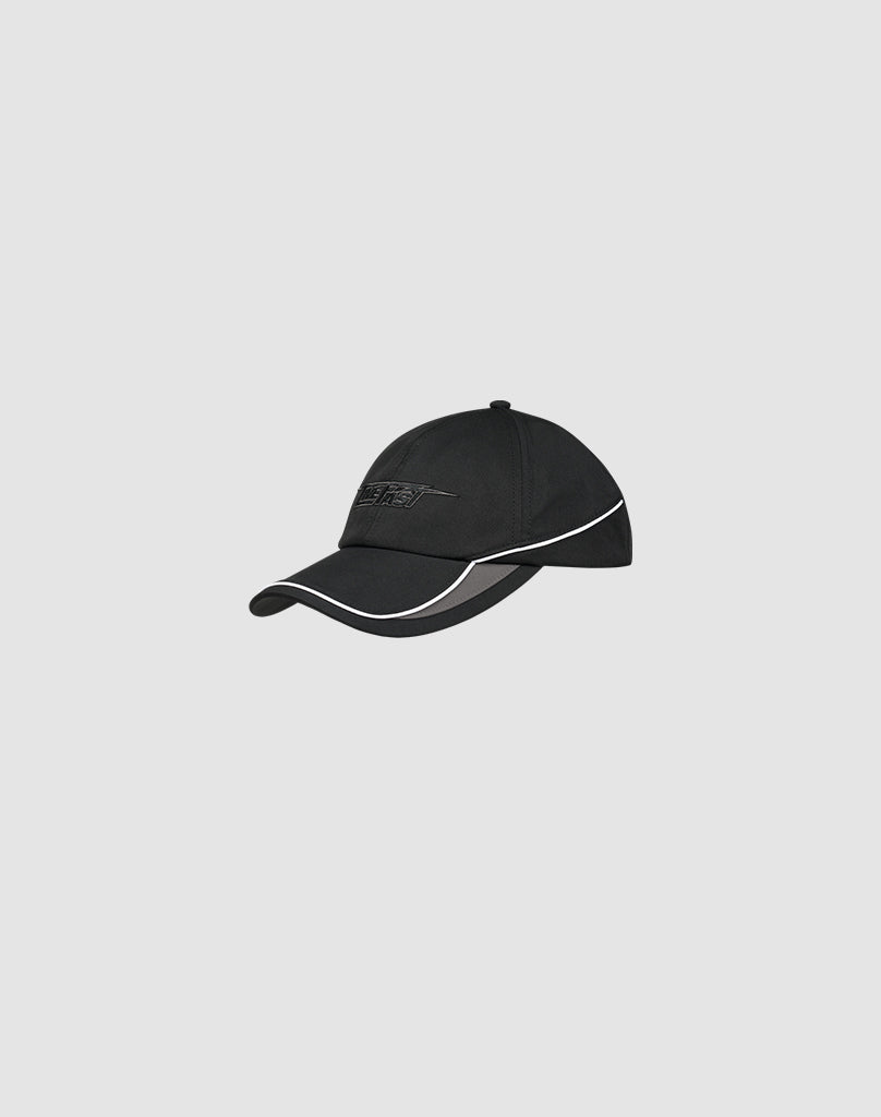 The LIVE FAST DIE YOUNG Live Fast 3000 Cap, a black polyester baseball cap with white trim along the visor and side and a subtle front logo-stick, is shown on a plain light gray background.