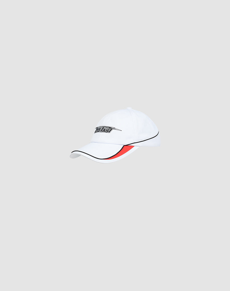 The LIVE FAST DIE YOUNG Live Fast 3000 Cap is a white cap with black pipings, a red underbrim, Logo-Stick front embroidery, and a Klettverschluss closure, shown against a light gray background.