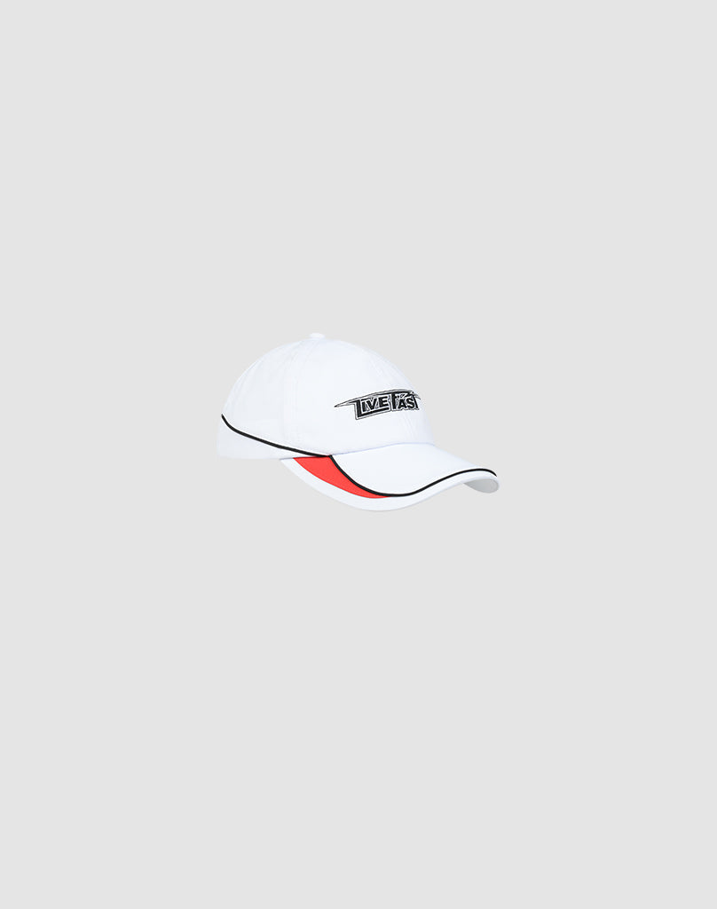 The Live Fast 3000 Cap by LIVE FAST DIE YOUNG features a white crown, black brim pipings, a red underbrim accent, and a small rectangular LIVE FAST Logo-Stick patch on the front, shown against a light gray background.