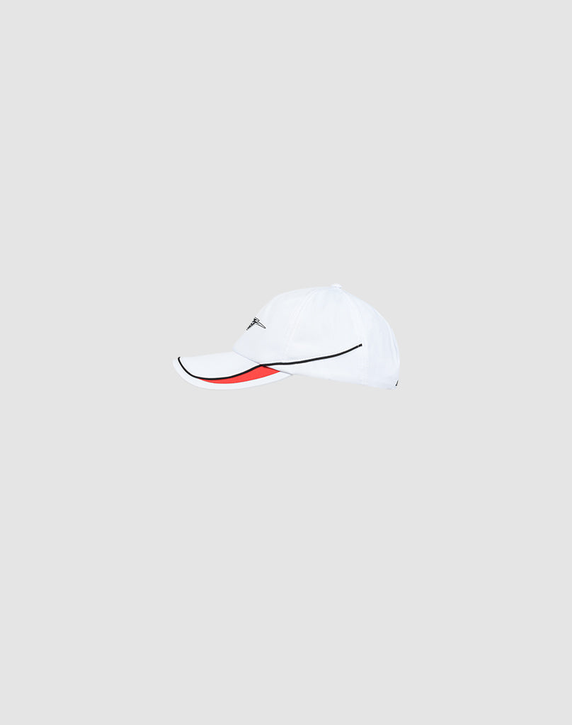 The LIVE FAST DIE YOUNG Live Fast 3000 Cap is a white baseball cap with piped trim on the curved brim, a black line detail, subtle logo stitching, and a red accent under the visor, shown on a plain light gray background.