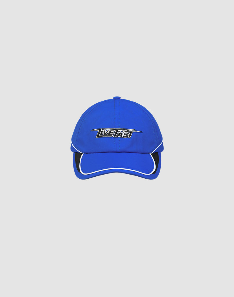 The Live Fast 3000 Cap by LIVE FAST DIE YOUNG is a blue polyester baseball cap with white trim and a silver and black IMPACT Logo-Stick on the front, shown against a plain light gray background.