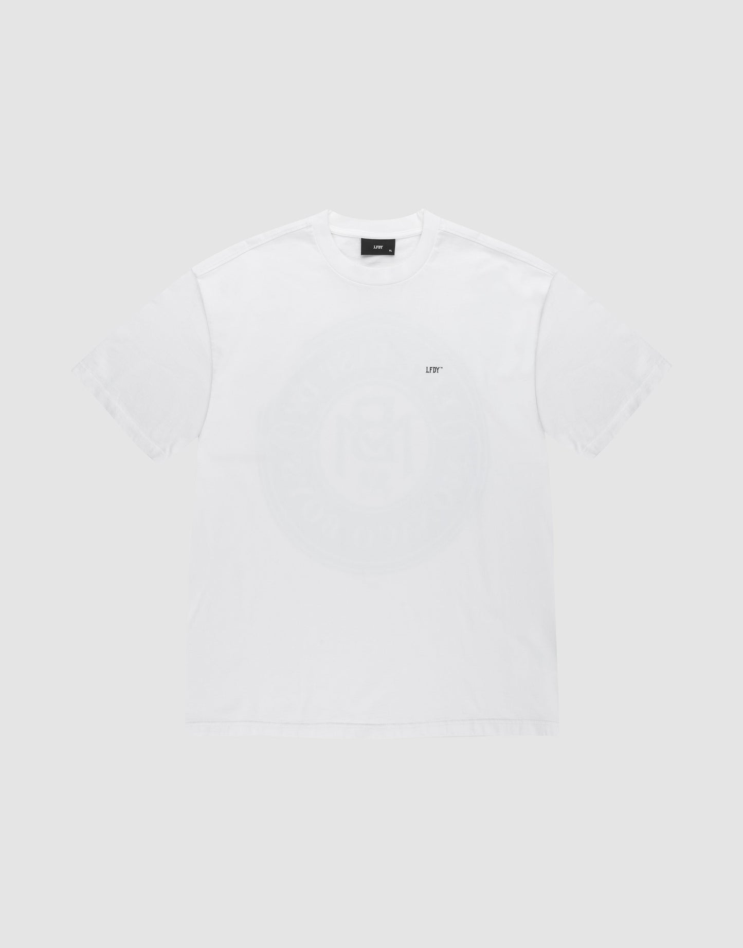 The LFDY Monaco Boys Tee by LIVE FAST DIE YOUNG is a white 100% Baumwolle short-sleeve shirt with a small UFT logo on the left chest, a faint circular center graphic, and subtle Vintage Optik, shown on a light gray background.