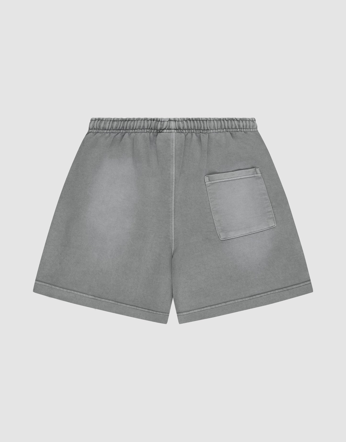 LIVE FAST DIE YOUNG Basic Sweat Shorts with an elastic waistband, single right back pocket, oversized fit, and subtle faded look, shown on a plain light background.