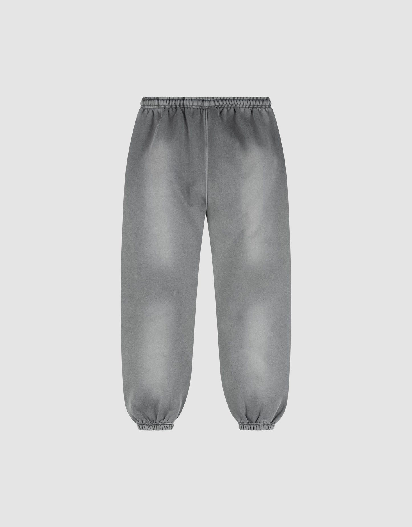 The LIVE FAST DIE YOUNG Basic Loose Jogger features a gray wash, relaxed fit, elastic waistband and cuffs, and an effortless Fade-Effekt. Displayed on a plain white background.