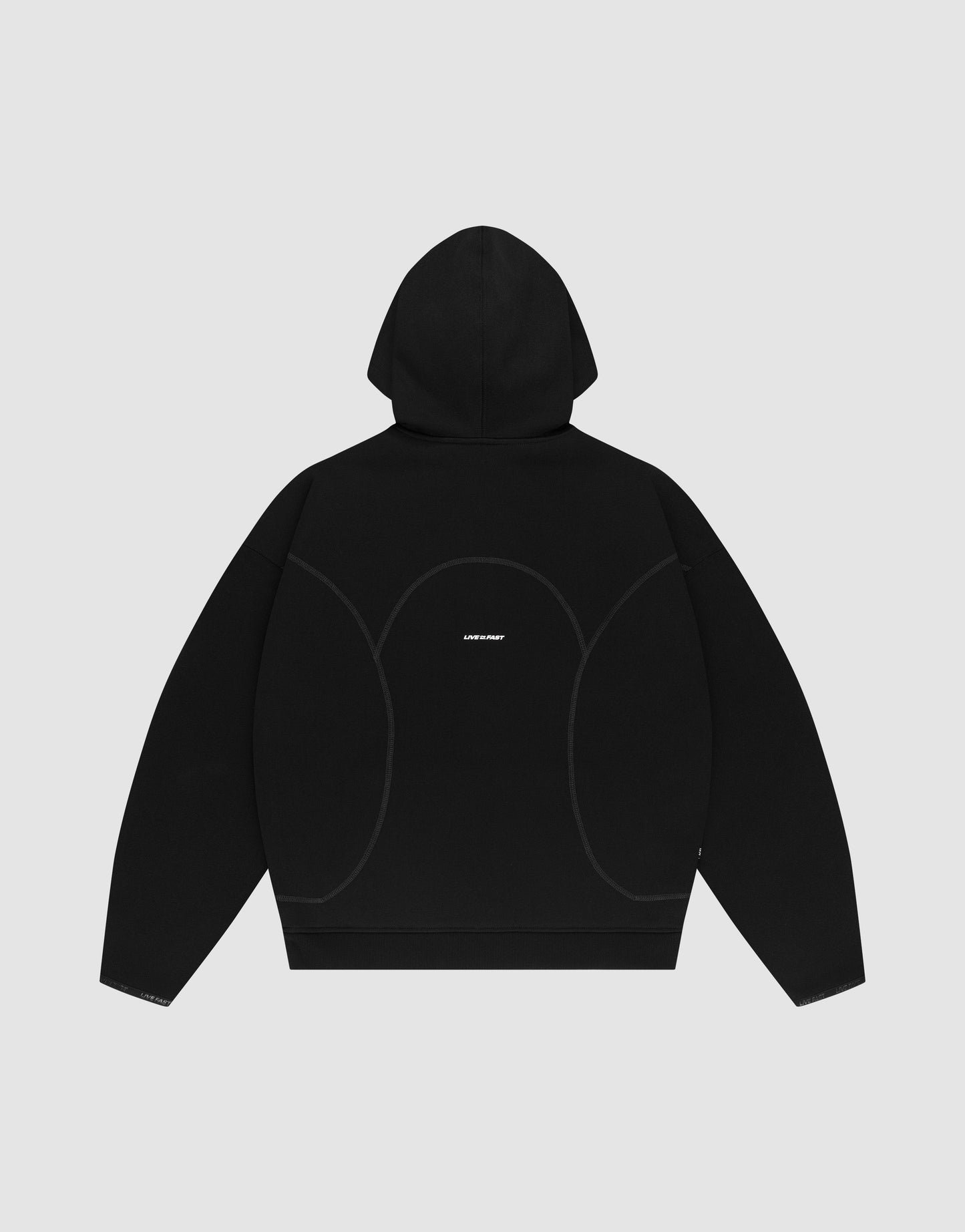The LIVE FAST DIE YOUNG LFDY Active Fleece Hooded Zip in black is shown laid flat, back facing up, highlighting subtle gray seams and a small white logo on the upper back against a light gray background.
