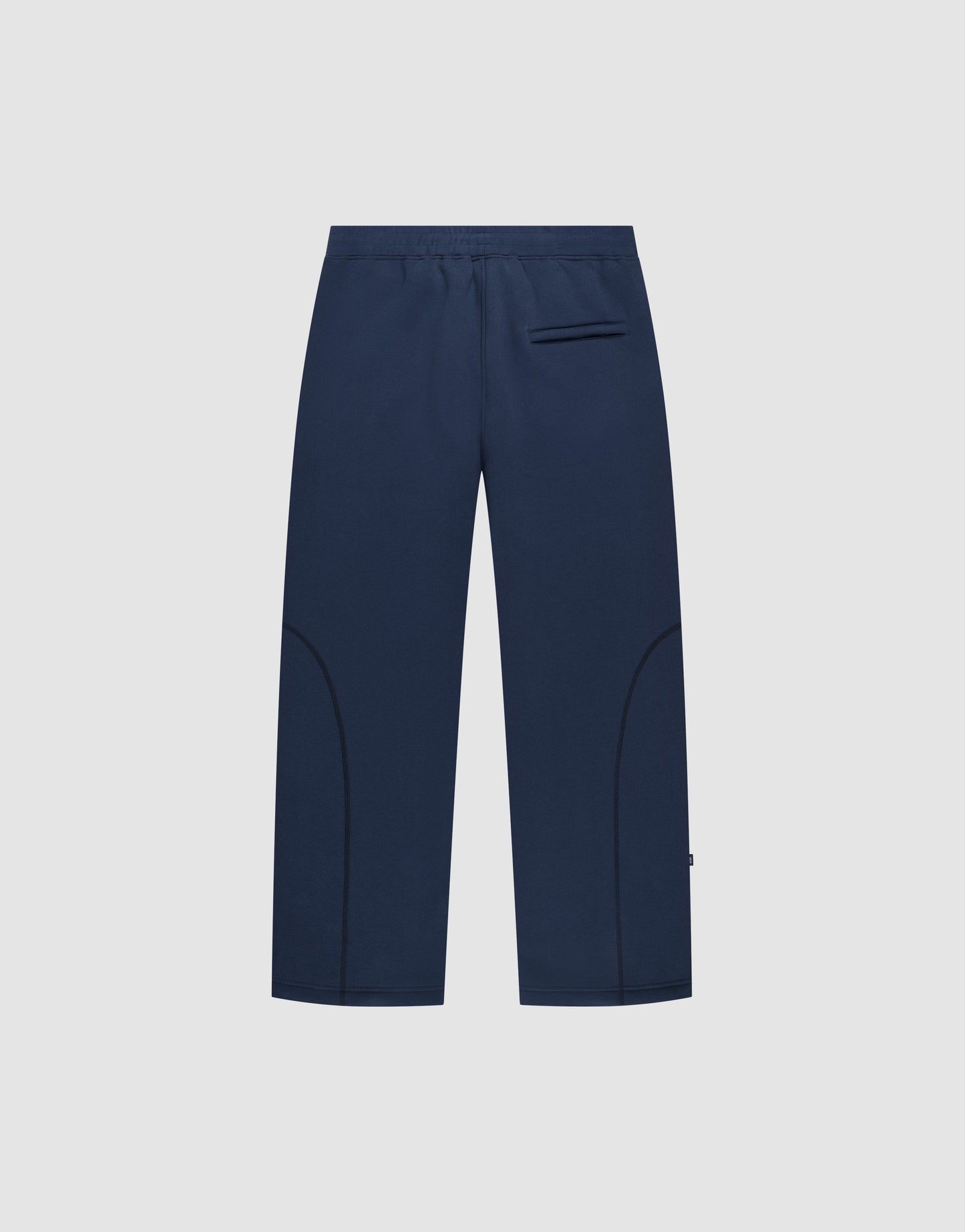 The LFDY Active Fleece Jogger by LIVE FAST DIE YOUNG features navy blue straight legs, an elastic waistband, a right back pocket, minimal leg seams, and a subtle logo print, shown against a light gray background.