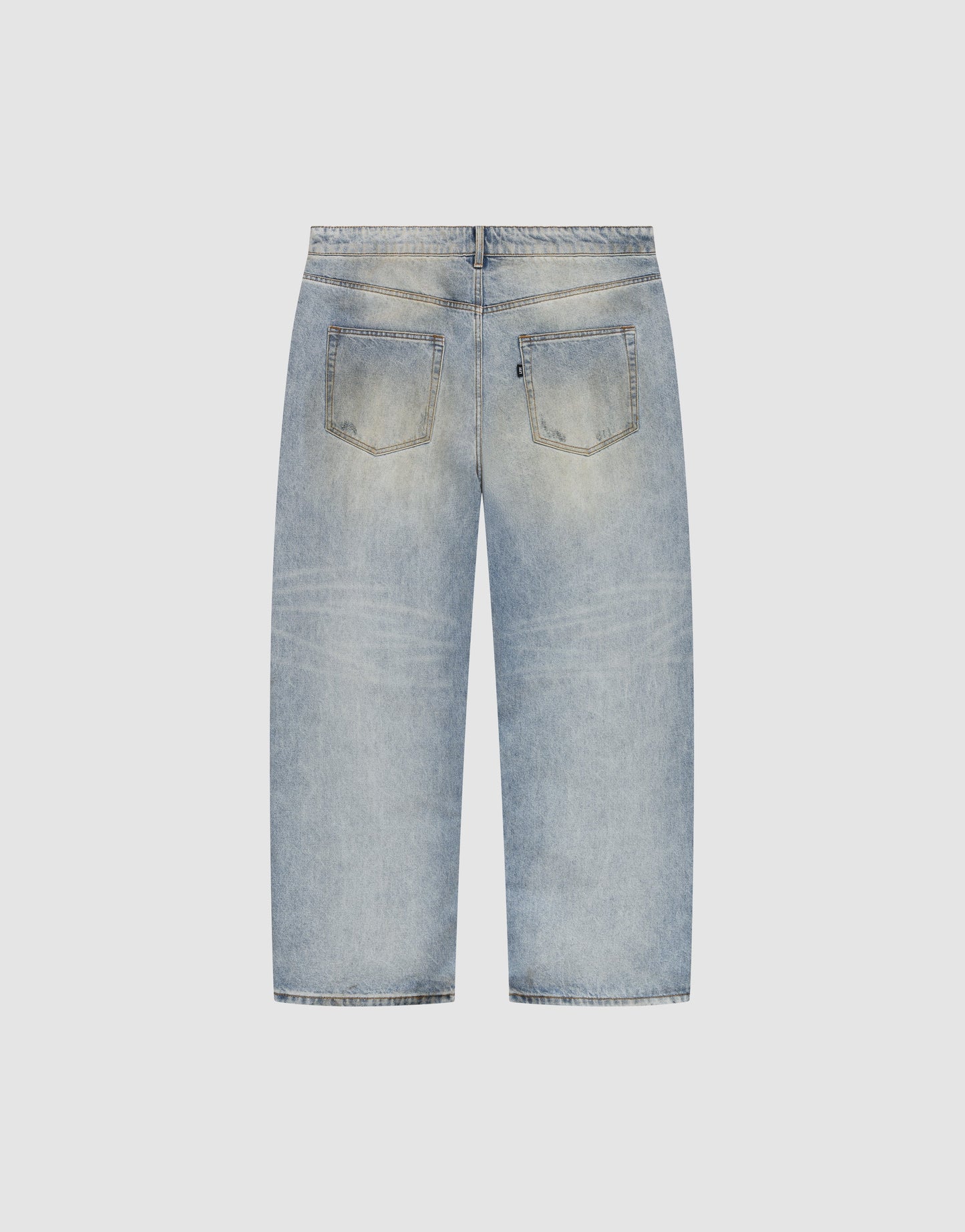 Back view of LIVE FAST DIE YOUNG’s LFDY Baggy Denim in light blue. These straight-leg jeans feature two back pockets, subtle fading, and a relaxed baggy fit, shown laid flat on a plain light background.