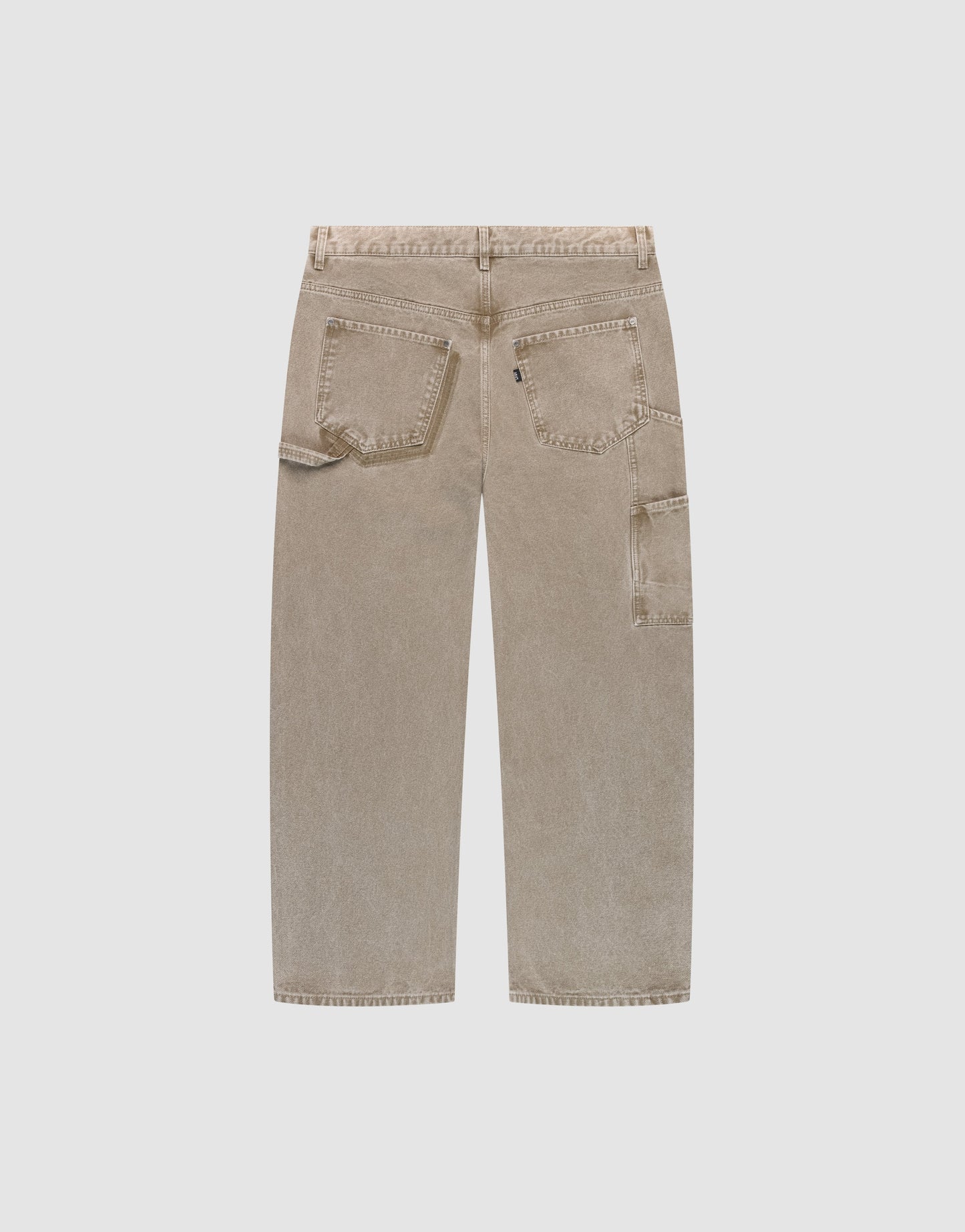 The Faded Carpenter Pants by LIVE FAST DIE YOUNG feature a beige, wide-leg baggy fit, two rear pockets, and a side utility pocket for a classic carpenter style, shown from the back on a light grey background.