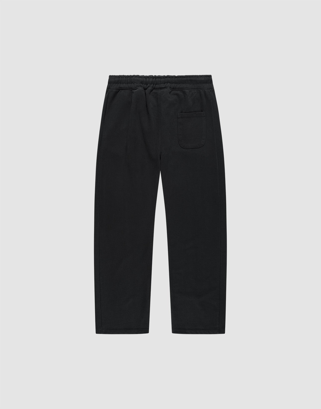 The Basic Wide Jogger by LIVE FAST DIE YOUNG features an elastic waistband, straight wide-fit legs, and a single back patch pocket, made from soft cotton and shown against a plain white background.