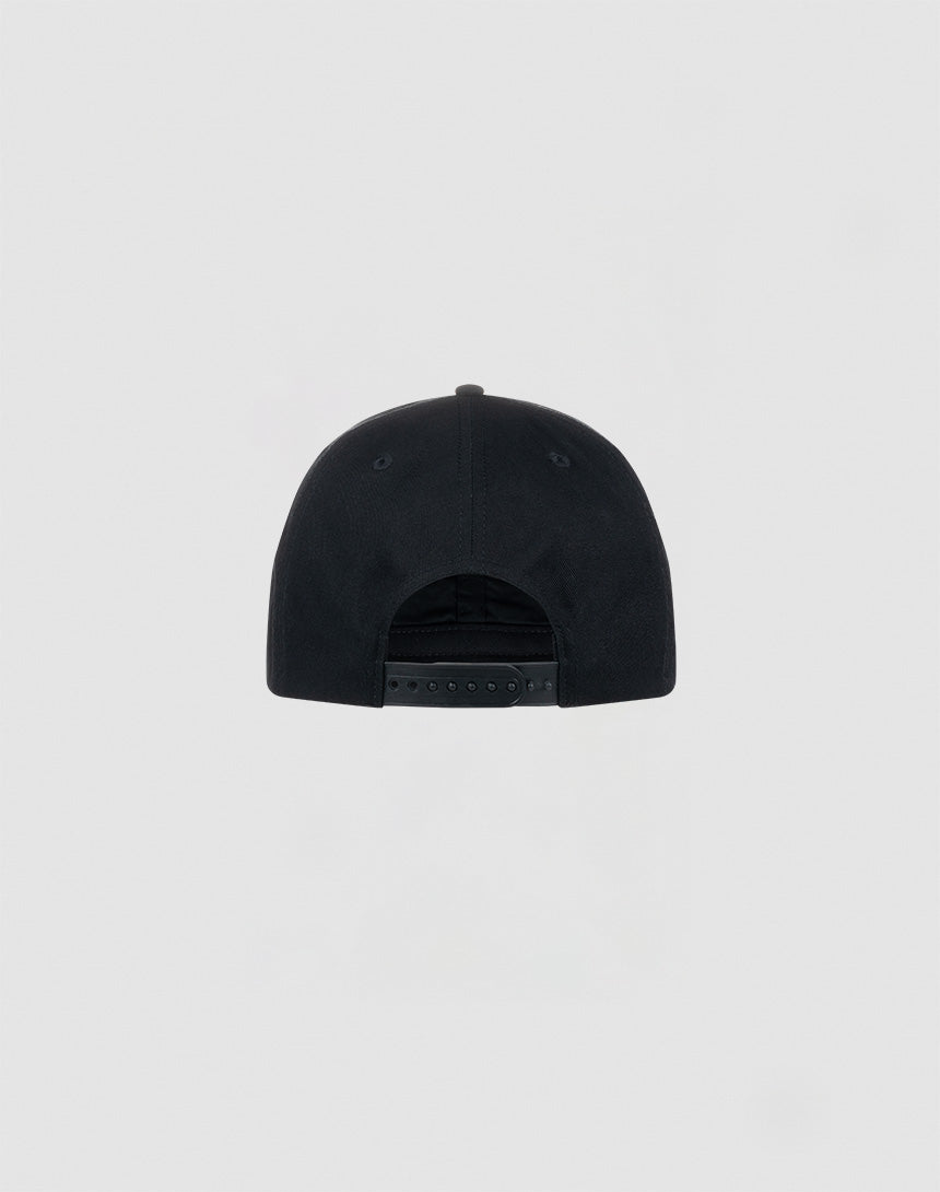 The LIVE FAST DIE YOUNG Live Fast Unstructured Cap is shown from the back, in black, with an adjustable Mit Snapverschluss closure and a subtle Flag Label detail on a plain light gray background.