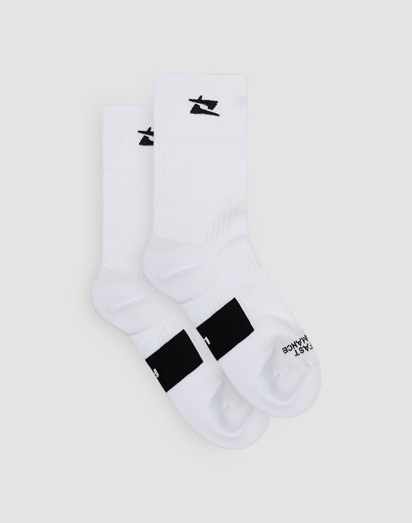 The Live Fast Performance Socks by LIVE FAST DIE YOUNG are white crew socks crafted from soft Baumwolle, with a black logo near the top and black toe text. Displayed on a light gray background. Available in Double Sizes 44-48.