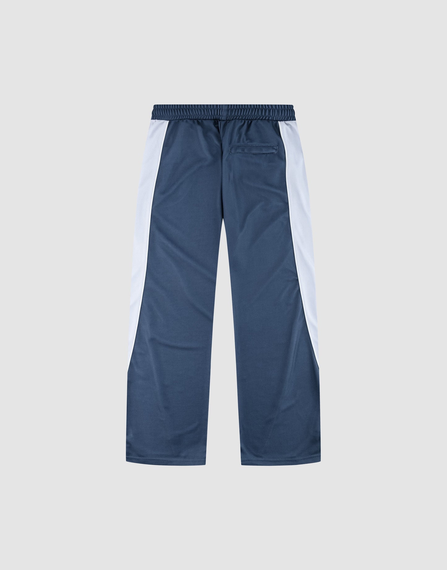 The LFDY DY Trackpants by LIVE FAST DIE YOUNG feature blue polyester in a wide fit with white side panels, an elastic waistband, and a single back pocket, shown flat on a light grey background.