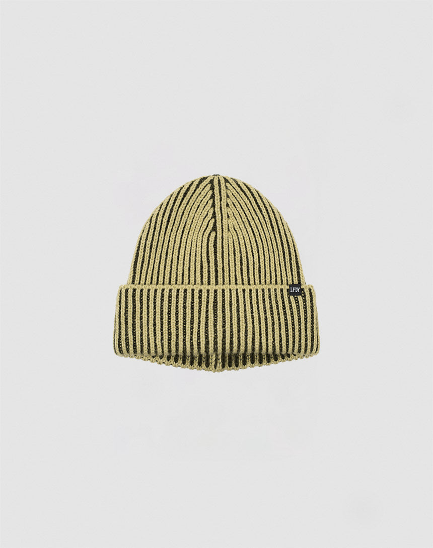 The 2 Tone Rib Knit Beanie by LIVE FAST DIE YOUNG features soft polyacryl ribbed knit, yellow and black vertical stripes, a folded brim, and a small black side tag, shown against a plain white background.