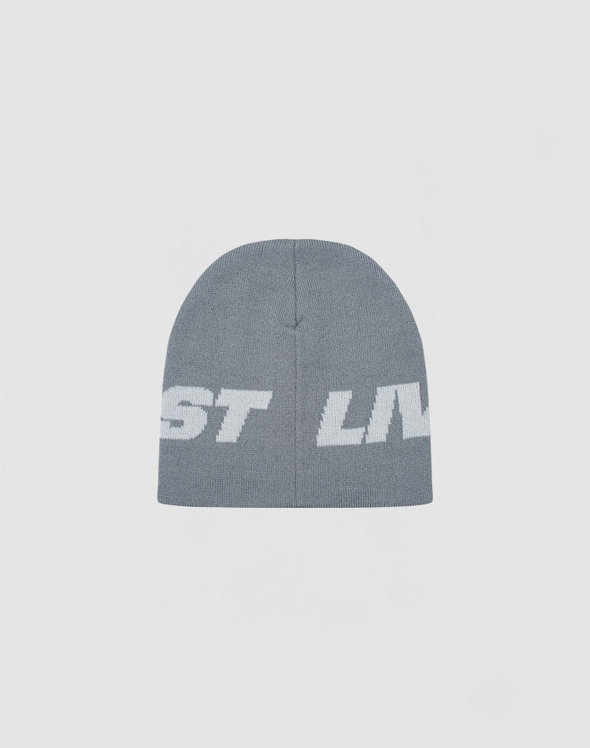 The Live Fast Jacquard Beanie by LIVE FAST DIE YOUNG is a gray Polyacryl knit beanie with a bold white ST LIV logo. Shown on a light background. Style code: LF2410-16486.