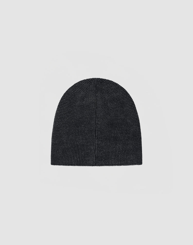 The DY Waffle Beanie by LIVE FAST DIE YOUNG, a plain, dark knit hat made from 100% Baumwolle, is shown against a light gray background.