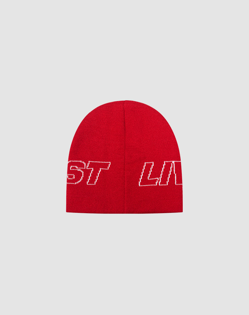 The Live Fast Jacquard Beanie by LIVE FAST DIE YOUNG is a red knit Polyacryl beanie, displaying a white-outlined logo with partially visible ST and LIV, shown on a plain light grey background.