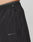 Close-up of the Live Fast Nylon Shorts by LIVE FAST DIE YOUNG, in black with an oversized fit, drawstring waist, and bold LIVE FAST silicone print by the pocket. Made from durable polyamide for lasting comfort.