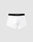 A pair of Live Fast Trunks (2 Pack) by LIVE FAST DIE YOUNG in white cotton features a black elastic waistband with LIVE FAST in white, set against a plain light gray background.