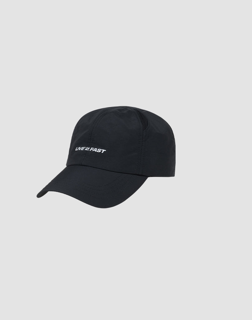 The Live Fast Performance Cap by LIVE FAST DIE YOUNG is a black nylon baseball cap with small, reflective LIVE FAST print on the front, shown on a plain light gray background. The cap is größenverstellbar for a comfortable fit.