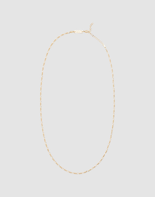The LIVE FAST DIE YOUNG Basic Figaro Chain is a delicate 925 gold-plated necklace with an adjustable length and simple clasp, shown on a plain light gray background.| plain 