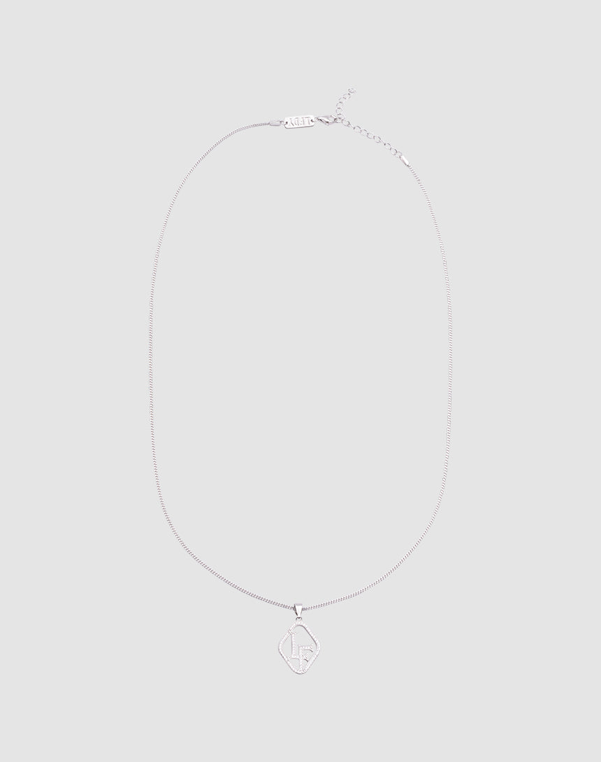 The LF Chain by LIVE FAST DIE YOUNG is a delicate Sterling Silber Kette with a diamond-shaped Zirkonia Anhänger engraved with LF in the center, shown on a light gray background and featuring verstellbare Länge for a perfect fit.| plain 