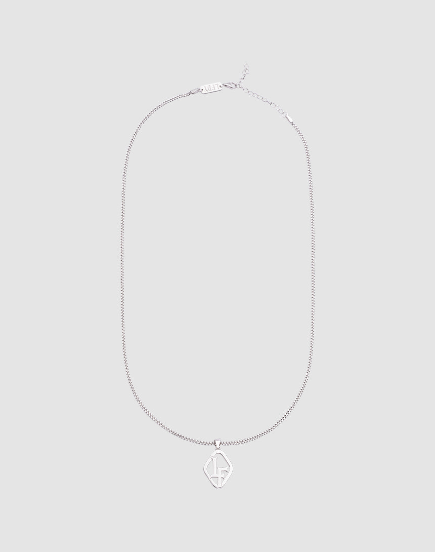 The LF Blank Chain by LIVE FAST DIE YOUNG is a 925 Sterling Silver necklace with a diamond-shaped stylized LF pendant, shown on a light gray background. Adjustable length ensures the perfect fit.| plain