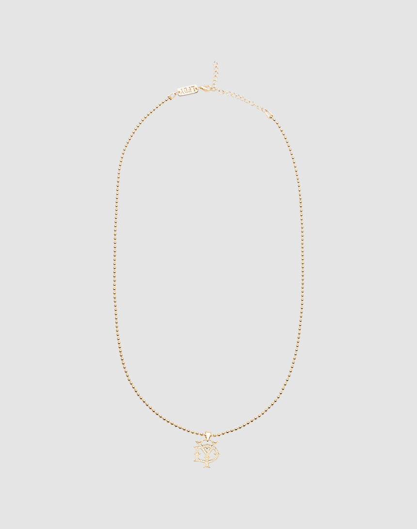 The DY Chain by LIVE FAST DIE YOUNG is a delicate vergoldet gold necklace with a sparkling NY Zirkonia pendant, shown on a plain light gray background.| plain