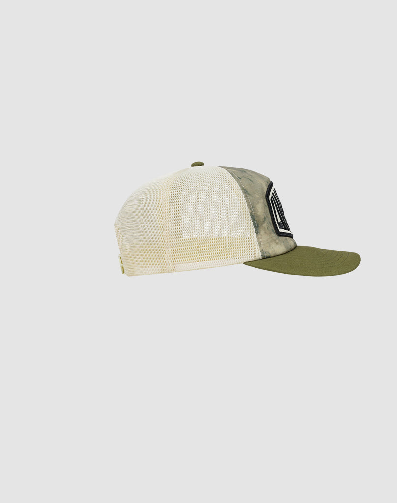 Side view of the LFDY Patched Trucker by LIVE FAST DIE YOUNG, featuring an olive green bill, mesh back panels, Logo-Stick patch on the front, and Snapverschluss. The cap is set against a plain light gray background.