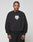 A man with braided hair wears the oversize DY Sweater by LIVE FAST DIE YOUNG, featuring black raglan sleeves and a white chest graphic. He stands against a plain light background with a neutral expression.