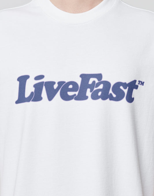 Close-up of the Basic Tee by LIVE FAST DIE YOUNG, featuring LiveFast™ in bold dark blue text on white. This oversized fit, model LF2404-15446, is made from 100% Baumwolle for ultimate comfort and appeal.