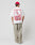 A person in an oversized white Hit and Run Tee by LIVE FAST DIE YOUNG, with bold red LIVE FAST text on the back, 100% Baumwolle, beige pants, and a red cap stands facing away against a plain light gray background.