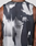 A close-up shows a person in the LFDY Performance Tank by LIVE FAST DIE YOUNG, made from light fabric with a black and white graphic print on the back. The Regular Fit highlights their arms and shoulders.