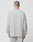 A person with short hair, seen from behind, wears the LIVE FAST DIE YOUNG Basic Longsleeve in an oversize fit and light gray 100% Baumwolle fabric with matching pants against a plain white background.