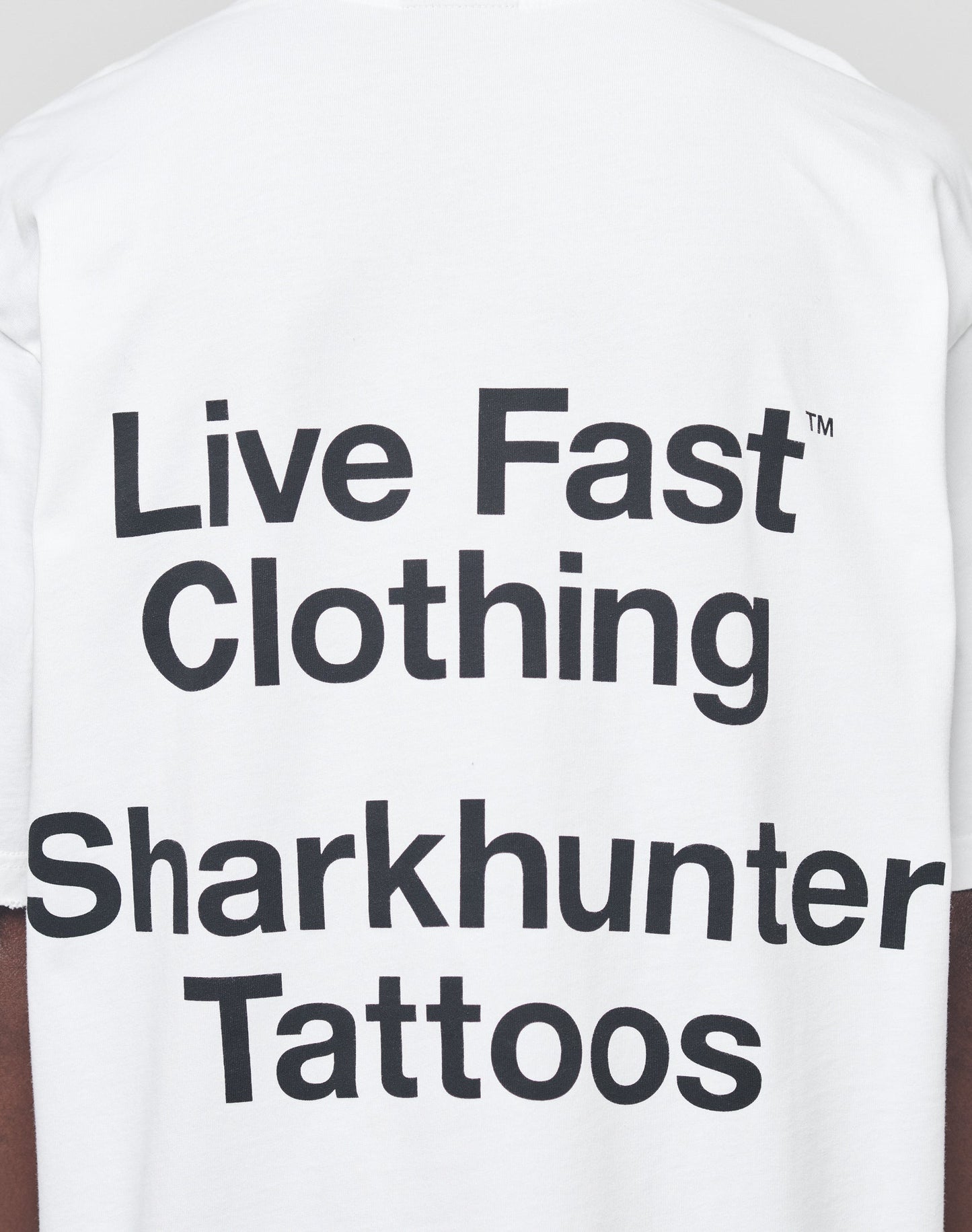 The LFDY Sharkhunter Tee by LIVE FAST DIE YOUNG features bold black text, 100% Baumwolle fabric, unique distressing, and an oversized fit for an edgy style.