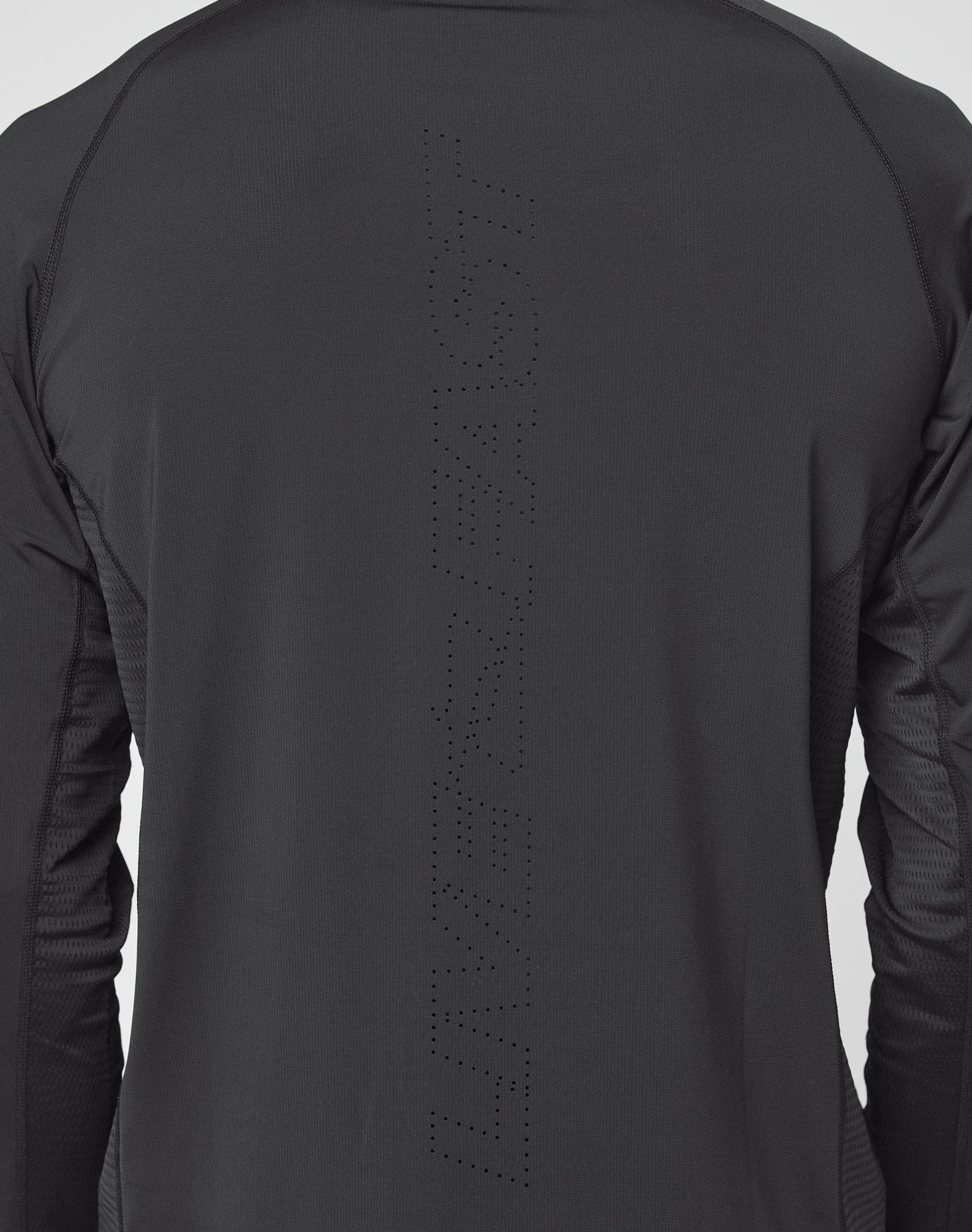 A close-up of the back of a black Live Fast Performance Longsleeve by LIVE FAST DIE YOUNG, featuring “LIVE FAST” subtly printed in small perforated dots down the center.