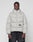 A man with braided hair wears the LIVE FAST DIE YOUNG Live Fast Puffer Jacket, a light gray, oversized, hooded style featuring a reflektierender Print and LIVE FAST graphic, standing against a plain white background.
