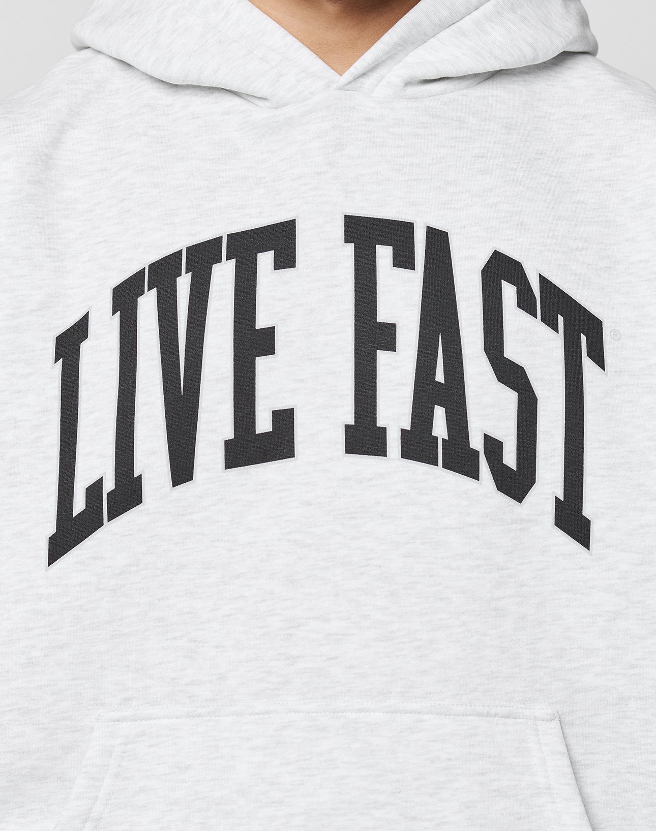 The Live Fast College Hooded by LIVE FAST DIE YOUNG is a light gray oversized hoodie with LIVE FAST boldly printed in black across the chest.